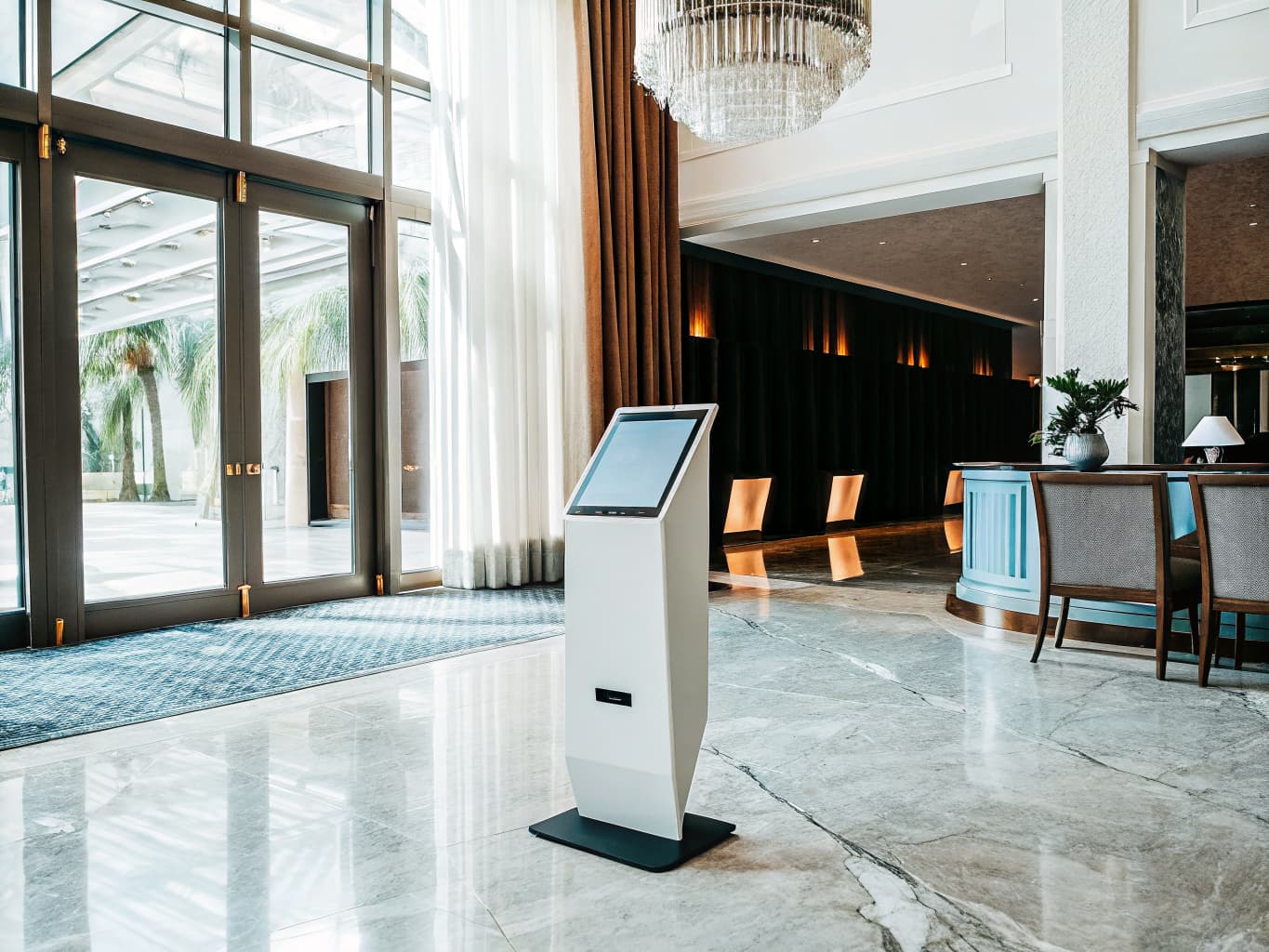 Elegant hotel lobby with marble floors and warm ambient lighting