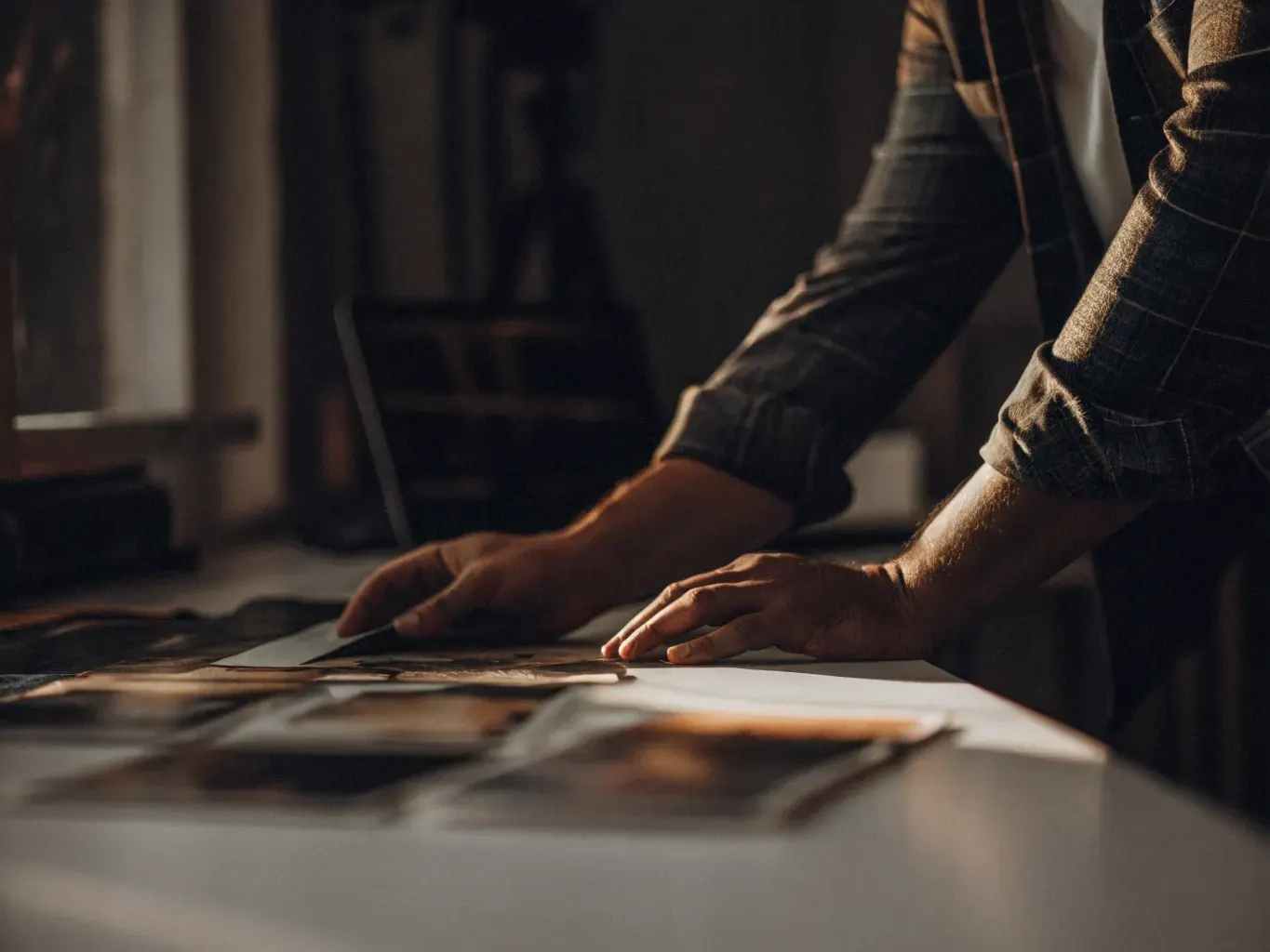 Creative director reviewing premium hotel brand design materials